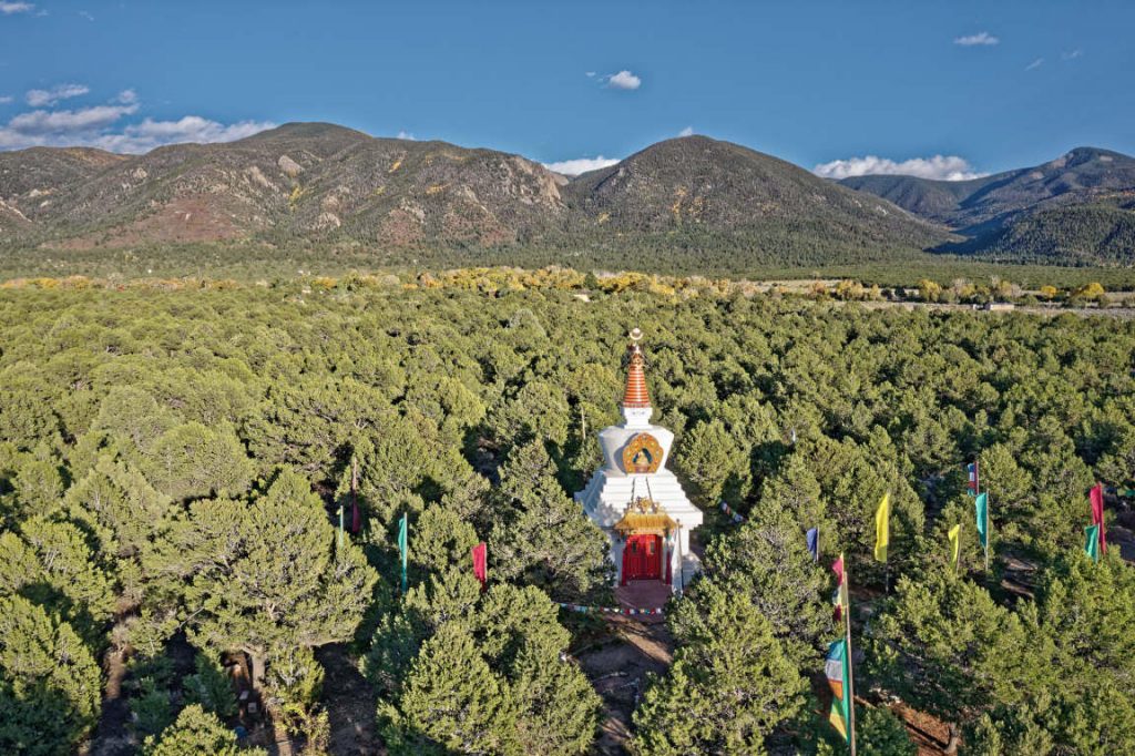 aerial view of stupa and mountains